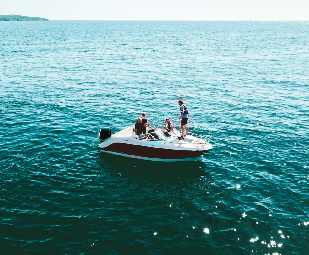 A boat equipped with ACEL's 75HP electric outboard motor, showcasing a sustainable and efficient solution for boating